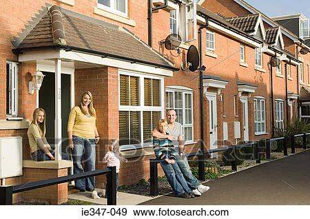 Family outside house View Large Photo Image Stock Photo - Family outside house. Fotosearch