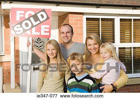 Family outside new house View Large Photo Image Stock Photo - Family outside new house. Fotosearch