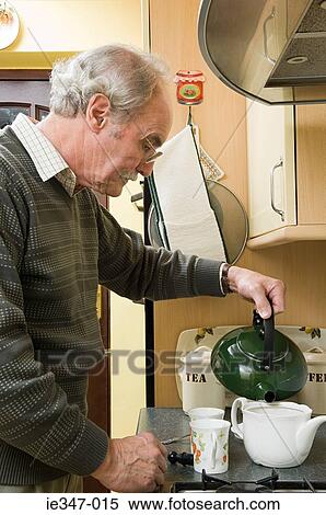Senior man making tea View Large Photo Image Stock Photography - Senior man making tea. Fotosearch