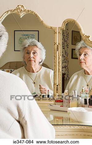 Senior woman at dressing table View Large Photo Image Picture - Senior woman at dressing table. Fotosearch