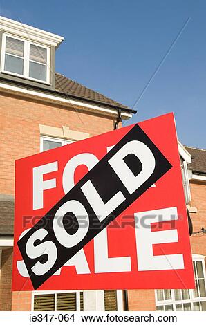 Sold sign and house View Large Photo Image Picture - Sold sign and house. Fotosearch