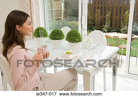 Woman having a coffee View Large Photo Image Stock Photo - Woman having a coffee. Fotosearch