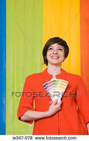 Stock Photo - Young woman with colours. Fotosearch