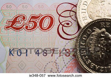 Stock Photo - Fifty pound note and one pound coin. Fotosearch