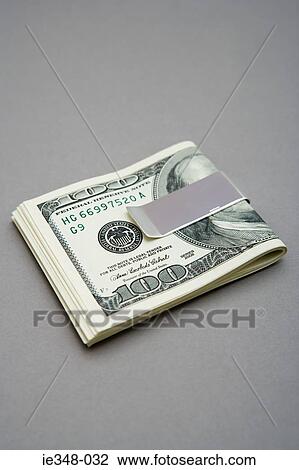 One hundred dollar bills in money clip View Large Photo Image Stock Image - One hundred dollar bills in money clip. Fotosearch