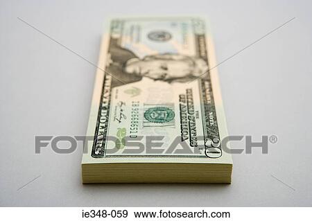Stock Photo - Stack of twenty dollar bills. Fotosearch