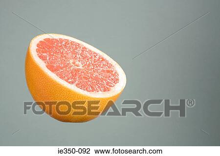 Half a grapefruit View Large Photo Image Stock Image - Half a grapefruit. Fotosearch