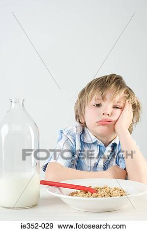 Boy at breakfast View Large Photo Image Stock Photo - Boy at breakfast. Fotosearch