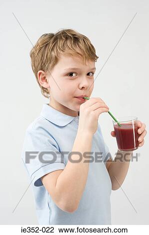 Stock Image - Boy drinking smoothie. Fotosearch