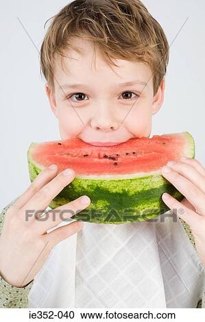 Boy eating watermelon View Large Photo Image Stock Image - Boy eating watermelon. Fotosearch