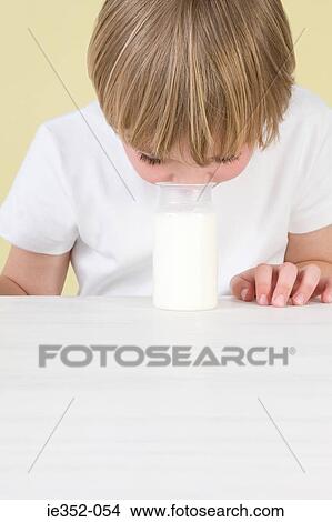 Boy smelling yoghurt View Large Photo Image Picture - Boy smelling yoghurt. Fotosearch