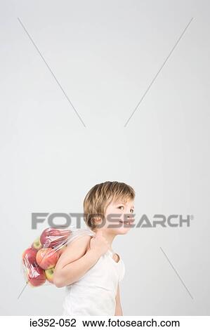 Boy with bag of apples View Large Photo Image Stock Image - Boy with bag of apples. Fotosearch