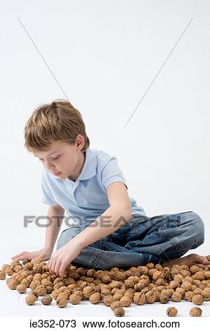 Boy with walnuts View Large Photo Image Stock Image - Boy with walnuts. Fotosearch