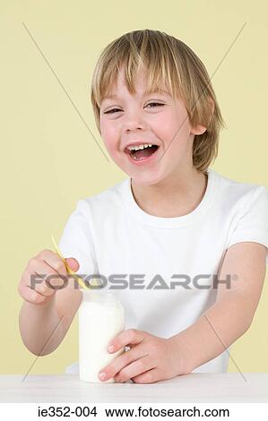 Picture - Boy with yoghurt. Fotosearch