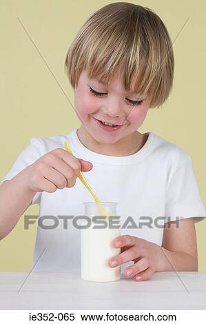 Stock Photography - Boy with yoghurt. Fotosearch