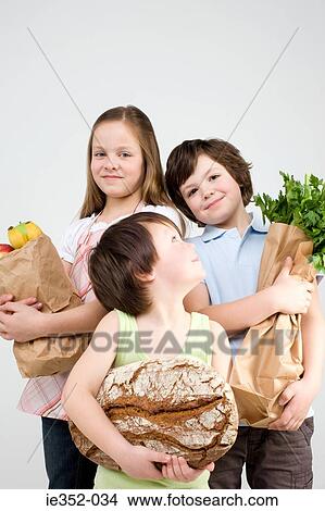 Children with groceries View Large Photo Image Picture - Children with groceries. Fotosearch