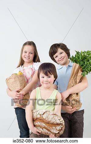 Children with groceries View Large Photo Image Stock Image - Children with groceries. Fotosearch