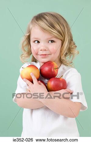 Girl holding apples View Large Photo Image Stock Photograph - Girl holding apples. Fotosearch