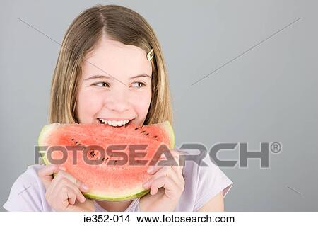 Girl with slice of watermelon View Large Photo Image Picture - Girl with slice of watermelon. Fotosearch