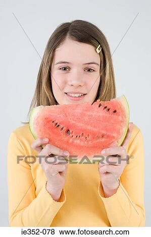 Girl with slice of watermelon View Large Photo Image Stock Photo - Girl with slice of watermelon. Fotosearch