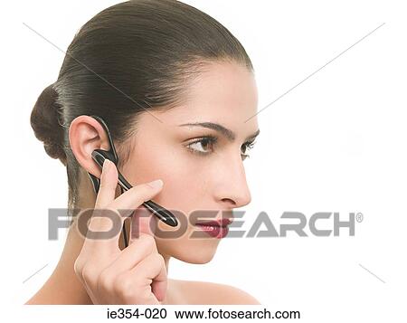 Woman using hands free device View Large Photo Image Stock Image - Woman using hands free device. Fotosearch