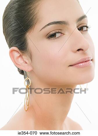 Woman wearing earrings View Large Photo Image Stock Image - Woman wearing earrings. Fotosearch