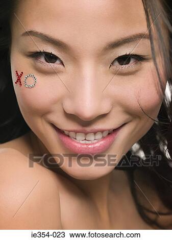 Woman with jewels on her face View Large Photo Image Stock Image - Woman with jewels on her face. Fotosearch