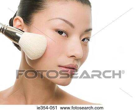 Woman with make up brush View Large Photo Image Stock Image - Woman with make up brush. Fotosearch