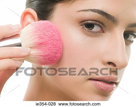 Stock Photo - Woman with make up brush. Fotosearch