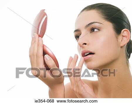 Stock Photo - Woman with mirror. Fotosearch