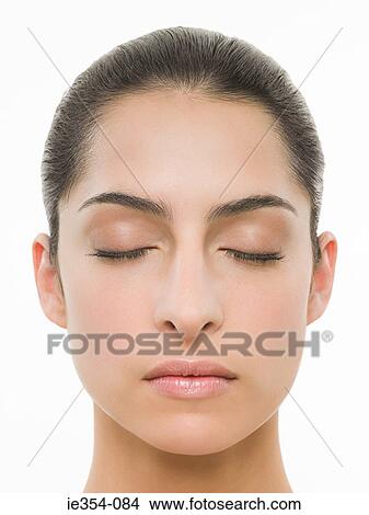 Young woman with eyes closed View Large Photo Image Picture - Young woman with eyes closed. Fotosearch