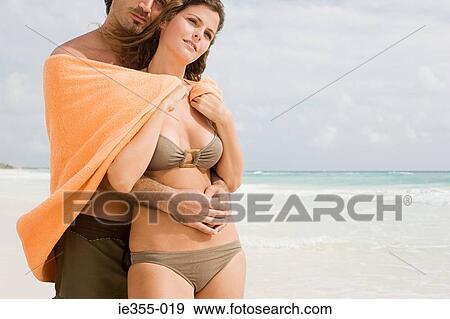 A couple on a beach View Large Photo Image Stock Photo - A couple on a beach. Fotosearch