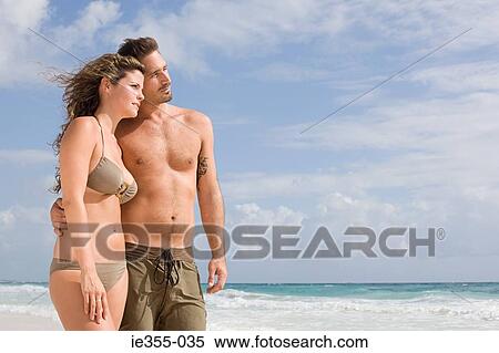 Stock Photography - A couple on a beach. Fotosearch