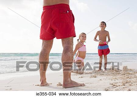 Picture - A family on a beach. Fotosearch