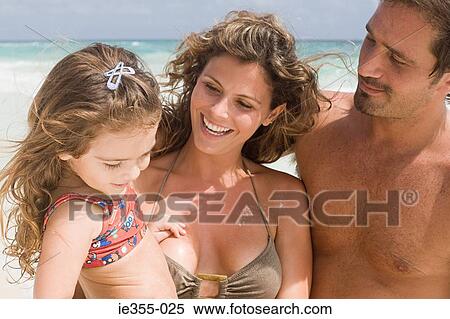 A family on a beach View Large Photo Image Stock Photography - A family on a beach. Fotosearch