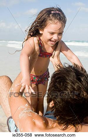 A father lifting his daughter View Large Photo Image Stock Photo - A father lifting his daughter. Fotosearch