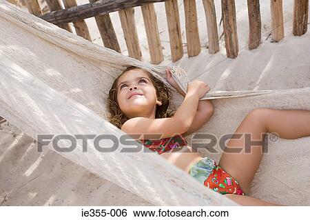 A girl on a hammock View Large Photo Image Stock Photograph - A girl on a hammock. Fotosearch
