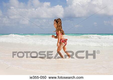 A girl running in the sea View Large Photo Image Stock Image - A girl running in the sea. Fotosearch