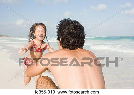 A girl running to her father View Large Photo Image Stock Image - A girl running to her father. Fotosearch