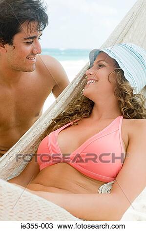 Stock Image - A young couple face to face. Fotosearch