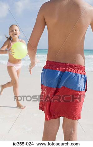 Children playing on the beach View Large Photo Image Picture - Children playing on the beach. Fotosearch