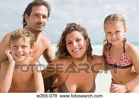 Stock Photo - Portrait of a family on a beach. Fotosearch