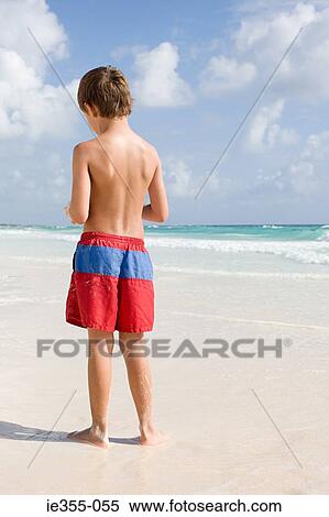 Rear view of a boy View Large Photo Image Stock Photography - Rear view of a boy. Fotosearch