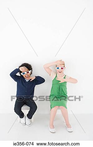 Boy and girl in 3D glasses View Large Photo Image Picture - Boy and girl in 3D glasses. Fotosearch