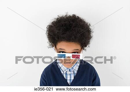 Boy wearing 3D glasses View Large Photo Image Stock Image - Boy wearing 3D glasses. Fotosearch