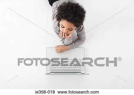 Stock Photo - Boy with a laptop. Fotosearch