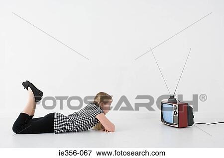 Girl watching television View Large Photo Image Stock Photo - Girl watching television. Fotosearch