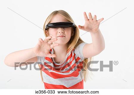 Girl wearing virtual reality headset View Large Photo Image Stock Image - Girl wearing virtual reality headset. Fotosearch
