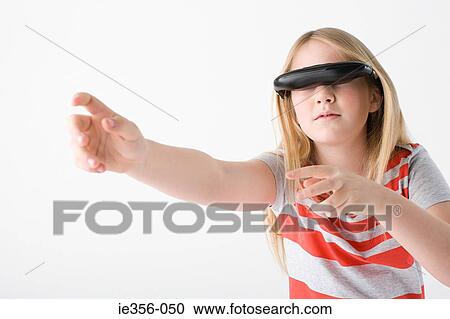 Girl wearing virtual reality headset View Large Photo Image Stock Image - Girl wearing virtual reality headset. Fotosearch