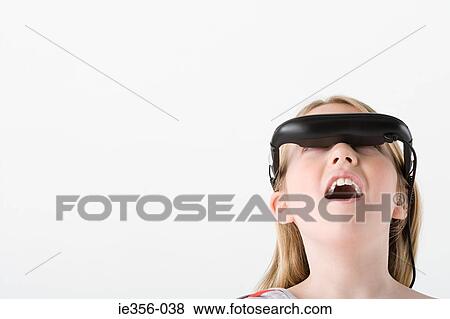 Girl wearing virtual reality headset View Large Photo Image Stock Photo - Girl wearing virtual reality headset. Fotosearch